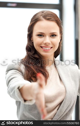 lovely woman with an open hand ready for handshake