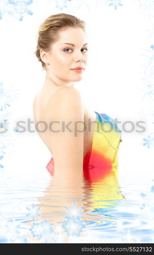 lovely woman with colorful cloth in water