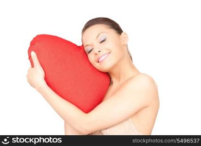 lovely woman with red heart-shaped pillow over white&#xA;