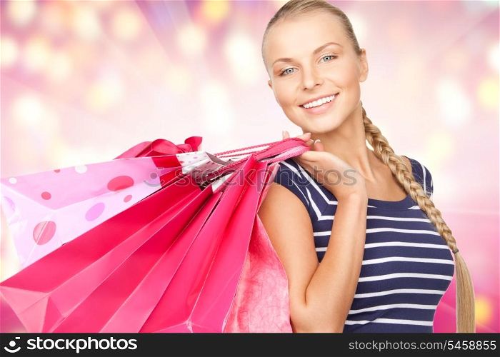 lovely woman with shopping bags over colorful background