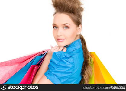 lovely woman with shopping bags over white