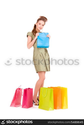 lovely woman with shopping bags over white