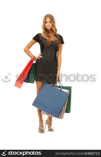 lovely woman with shopping bags over white