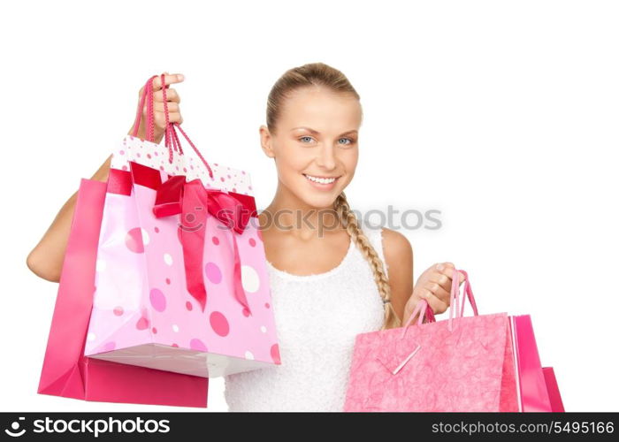 lovely woman with shopping bags over white