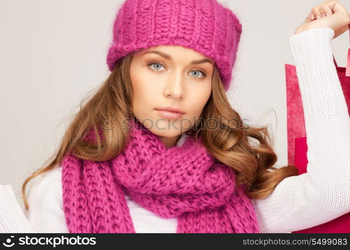 lovely woman with shopping bags over white