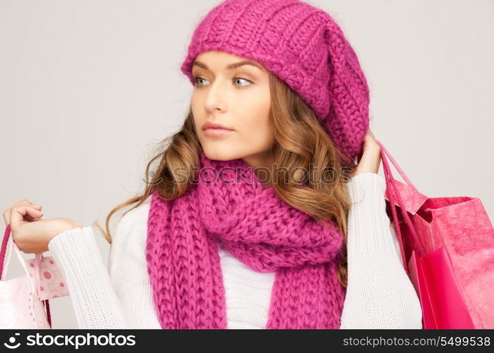 lovely woman with shopping bags over white