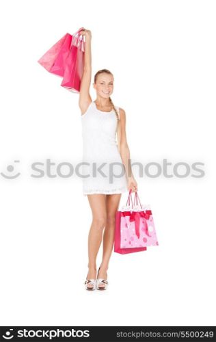 lovely woman with shopping bags over white