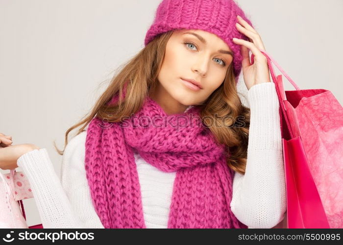 lovely woman with shopping bags over white