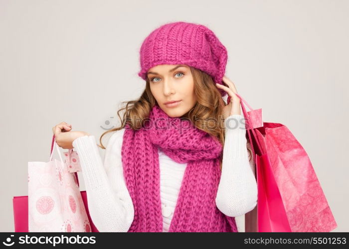 lovely woman with shopping bags over white