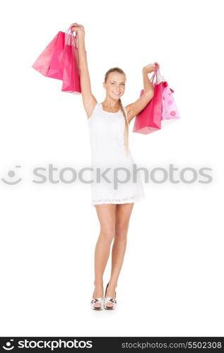 lovely woman with shopping bags over white