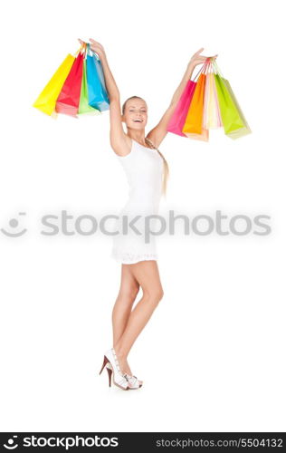 lovely woman with shopping bags over white