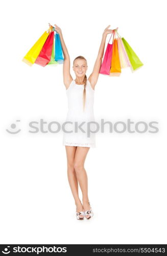 lovely woman with shopping bags over white