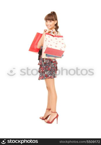 lovely woman with shopping bags over white