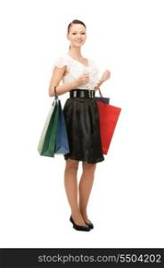 lovely woman with shopping bags over white&#x9; &#xA;