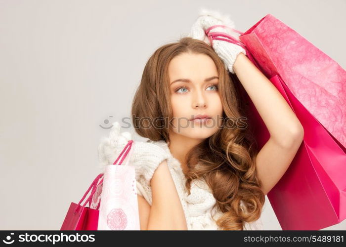 lovely woman with shopping bags over white&#xA;