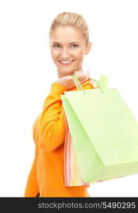 lovely woman with shopping bags over white&#xA;