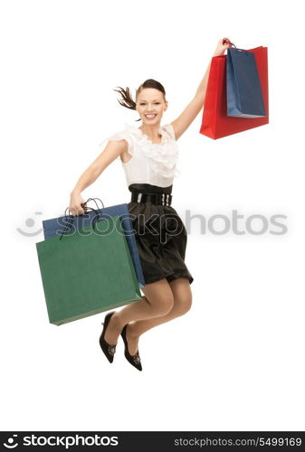 lovely woman with shopping bags over white&#xA;