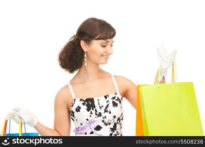 lovely woman with shopping bags over white&#xA;