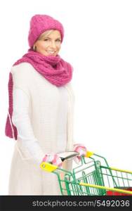 lovely woman with shopping cart over white