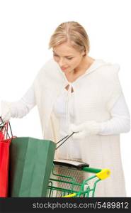 lovely woman with shopping cart over white&#xA;