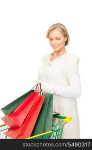 lovely woman with shopping cart over white&#xA;