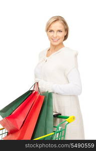 lovely woman with shopping cart over white&#xA;