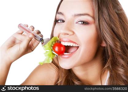 lovely woman with tomato on fork on white background