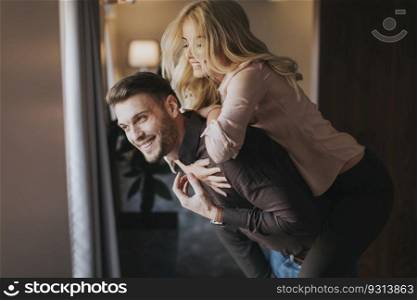 Lovely young couple having fun in the room