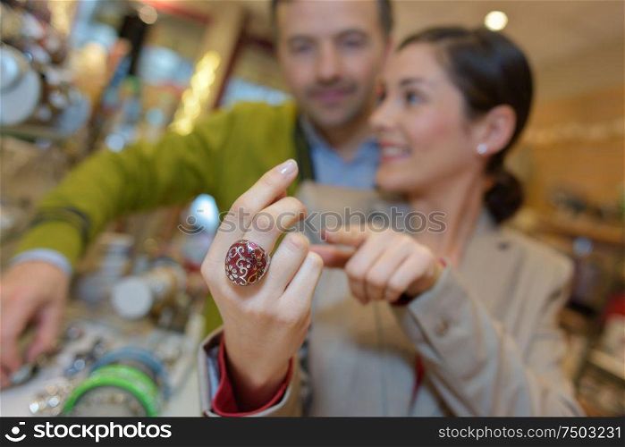 lovers choosing jewellery at the mall