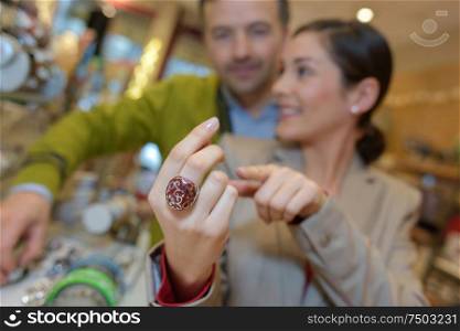 lovers choosing jewellery at the mall