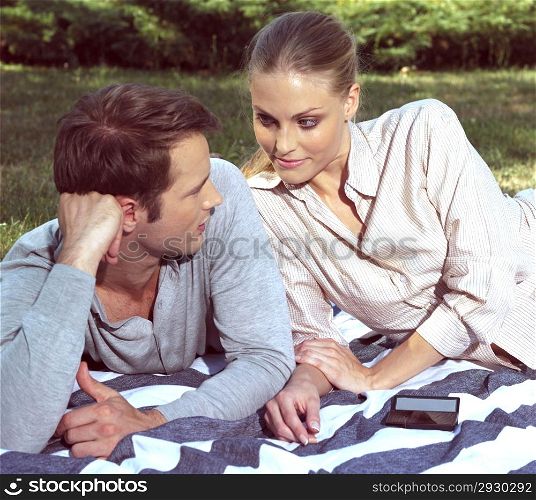 lovers couple relaxing in square