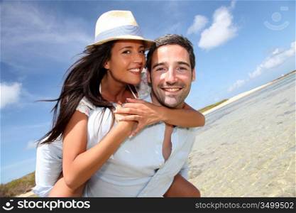 Lovers enjoying sunny day at the beach