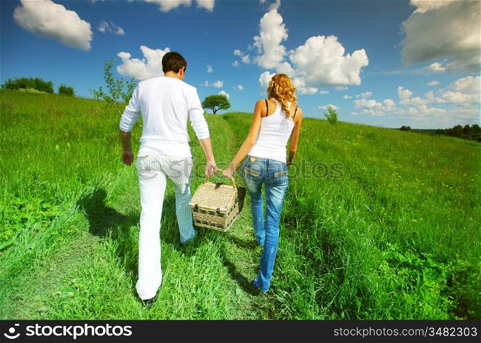 lovers go to picnic by green hill