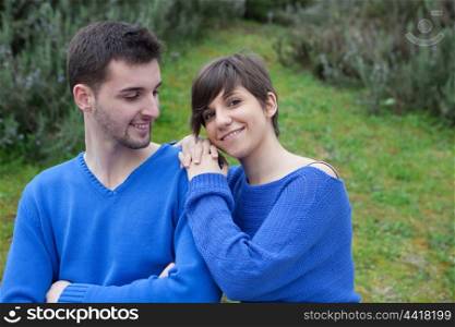 Lovers in the park dressed in blue