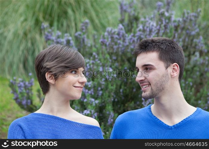 Lovers in the park dressed in blue