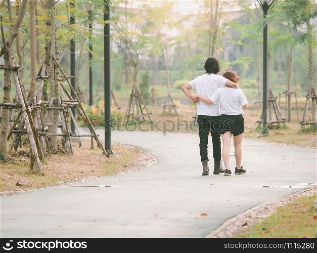Loving asian couple enjoying in moments of happiness in the park. Happy romantic asia couple in love and having fun.