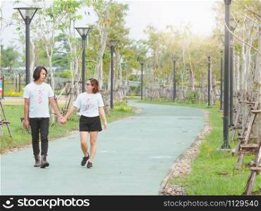 Loving asian couple enjoying in moments of happiness in the park. Happy romantic asia couple in love and having fun.