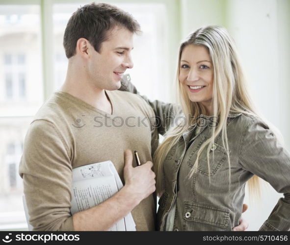 Loving business couple in office