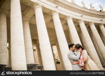 Loving couple at the St. Peter’s Square in Vatican, Italy