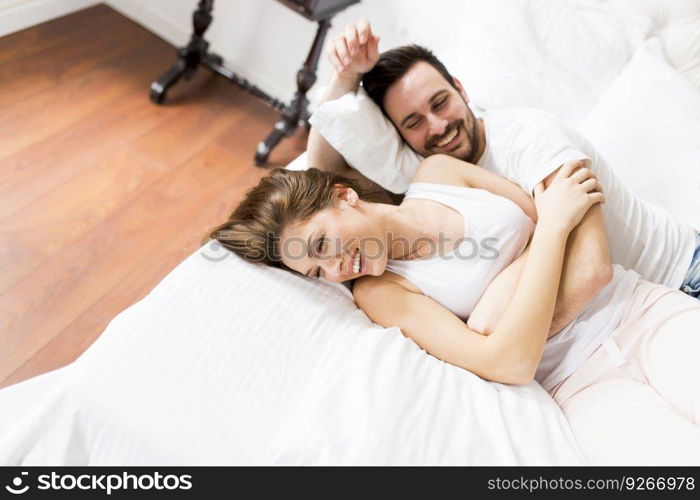 Loving couple having fun in bed