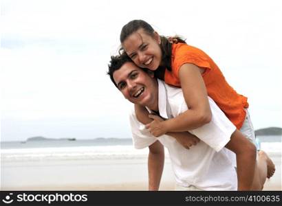 Loving couple having fun on the beach