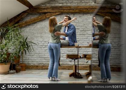 Loving couple hugging in the rustic room