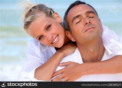 Loving couple hugging on the beach