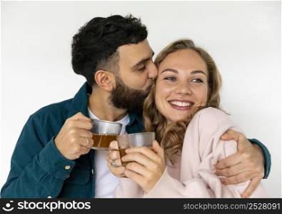 loving couple making tea home together