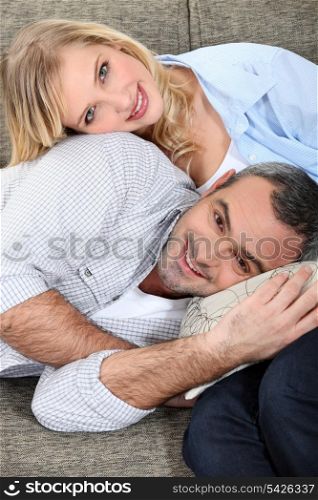 Loving couple sitting on a sofa