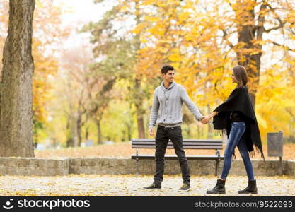 Loving couple walking in the autumn park