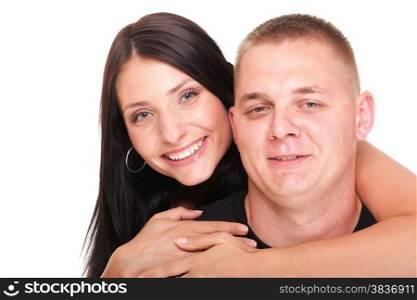 Loving embracing Portrait of a beautiful young happy smiling couple isolated