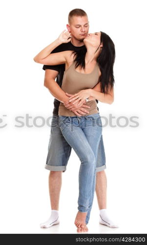 Loving embracing Portrait of a beautiful young happy smiling couple isolated