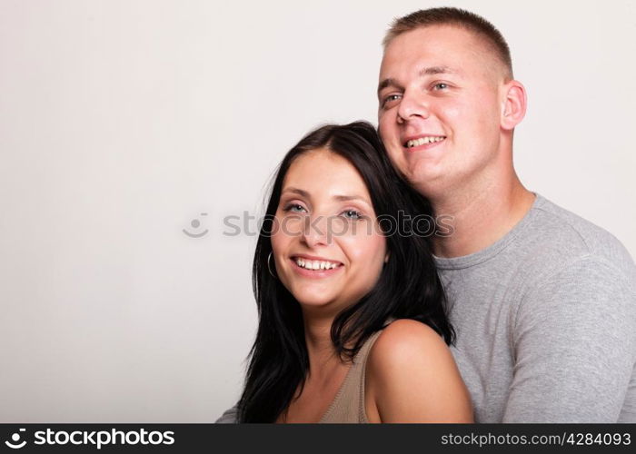 Loving embracing Portrait of a beautiful young happy smiling couple young relaxing