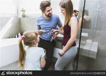 loving family with toothbrushes